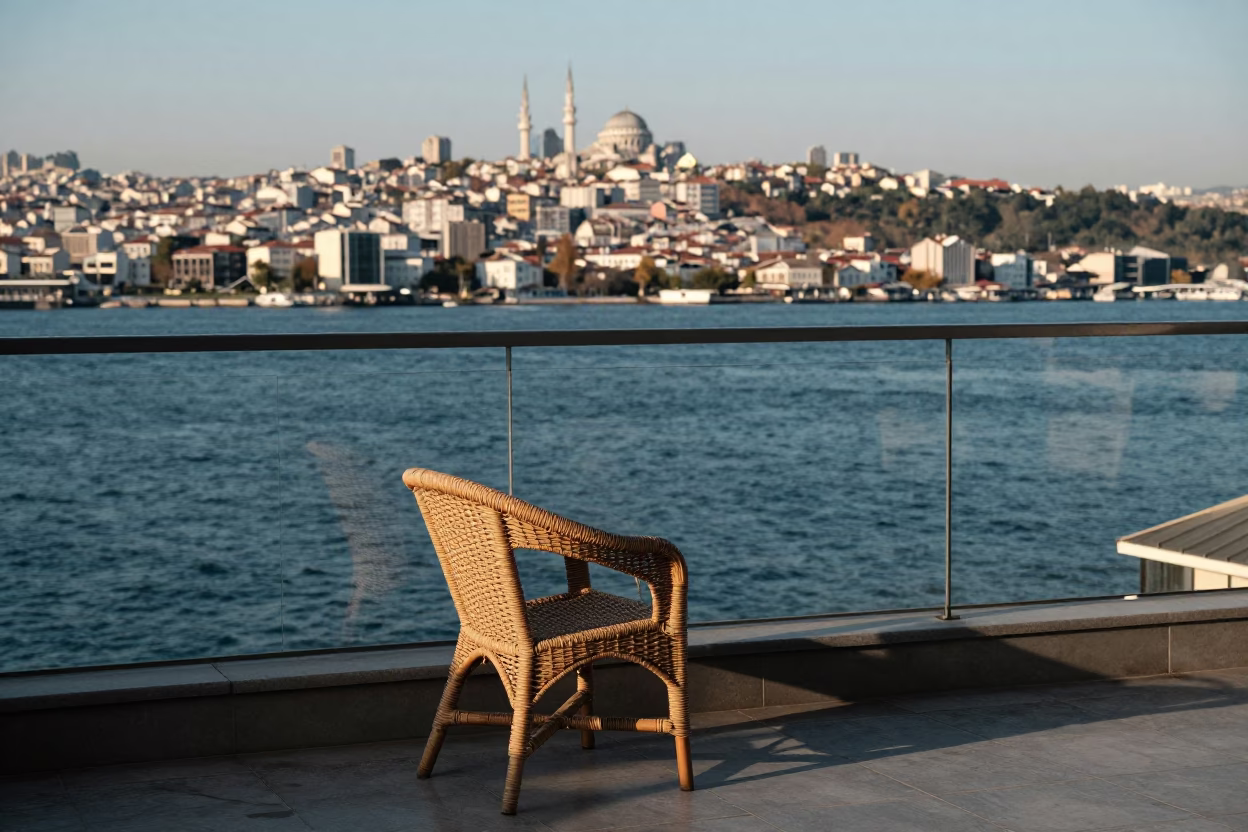 Rattan Chair on Balcony Overlooking Istanbul Bosphorus Strait Early Afternoon in in Istanbul, Turkey