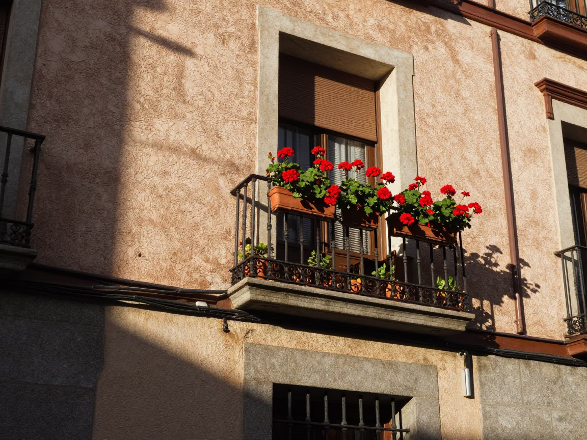 Realistic Early Afternoon Street Scene in Madrid Spain with Balcony Geraniums in in Madrid, Spain