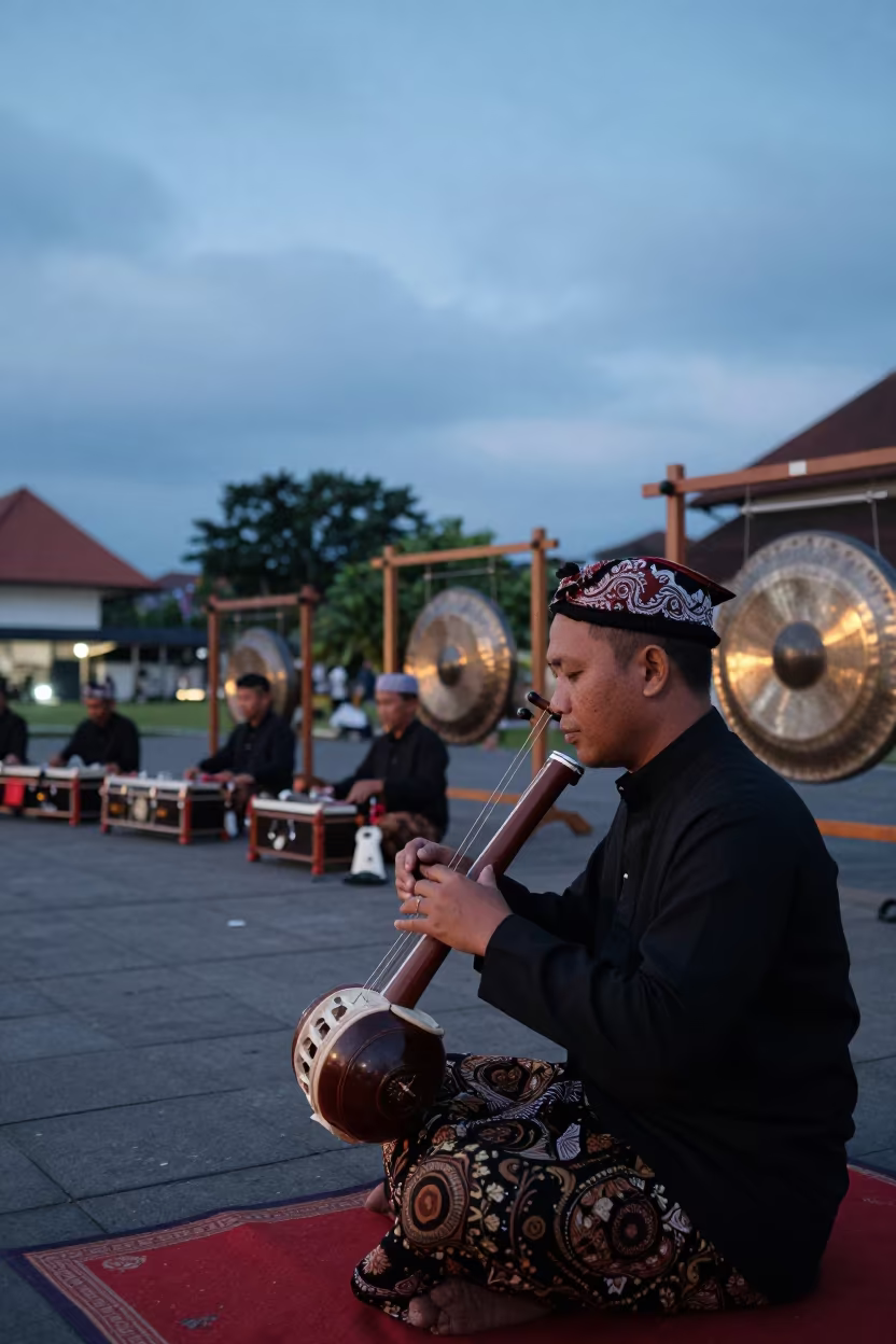 Rebab Player at Twilight in Yogyakarta Square in at a public square during a festival in Yogyakarta