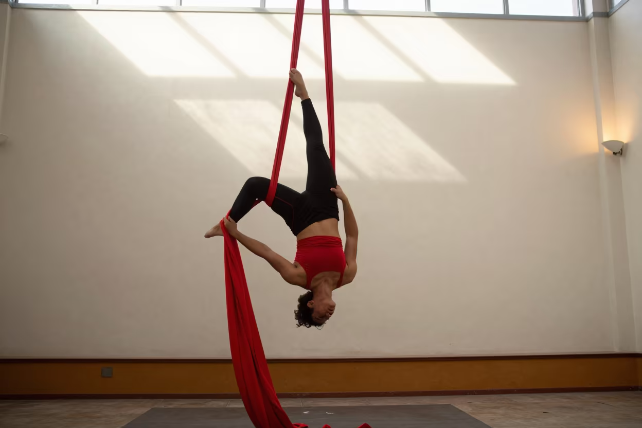 Red Aerial Silks Spiraling Down in Huacho in on a painted display ledge in Huacho