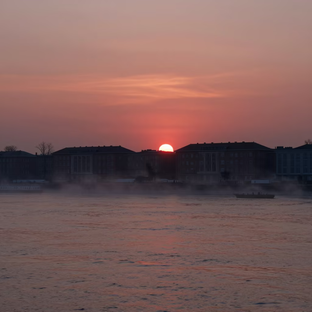 Red Sunset Through Marine Fog Over Budapest in through low marine fog near Obuda, Budapest