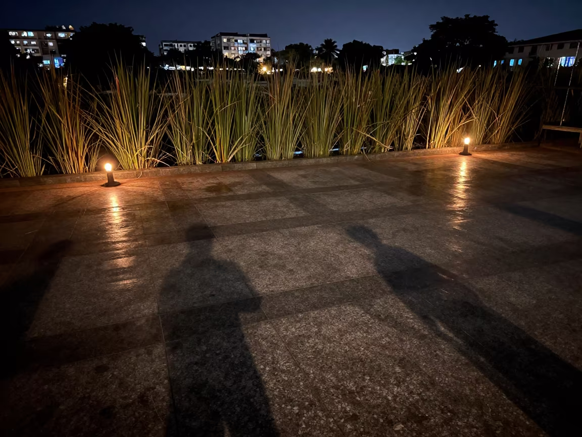 Reed Silhouettes Over Candlelit Station Floor in inside a restored train terminal in Sovabazar, Kolkata