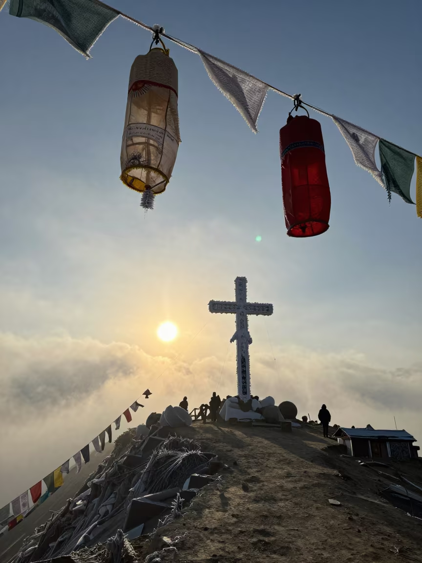 Rime Ice Monster Summit Cross Backlit in on a wind-cut ridge below prayer flag lines near Kathmandu