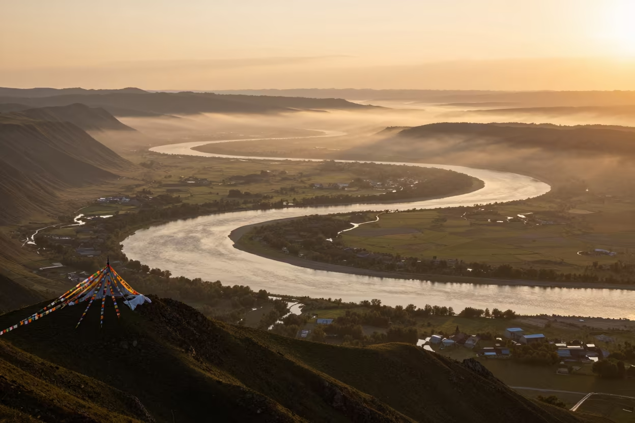 River Meanders Under Copper Sunset from High Altitude in on a wind-cut ridge below prayer flag lines near Shimla