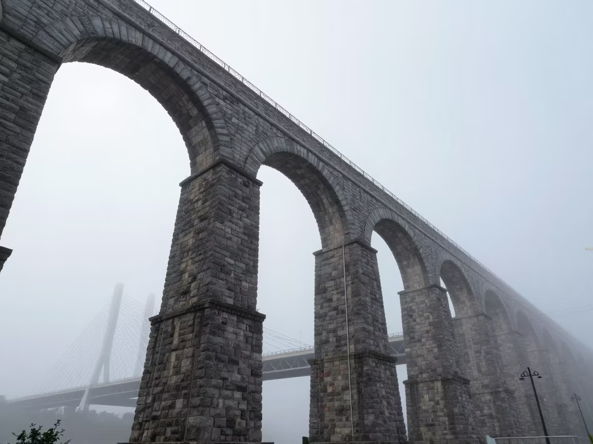 Roman Aqueduct Under Jinan Bridge Mist in under a cable-stayed bridge span in Jinan