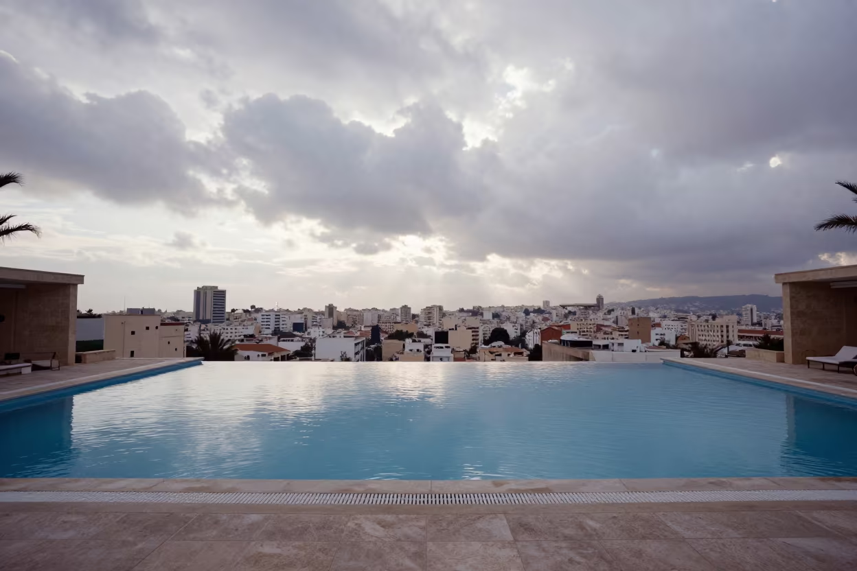Rooftop Infinity Pool Overlooking Berrechid Skyline in inside a vaulted atrium in Berrechid