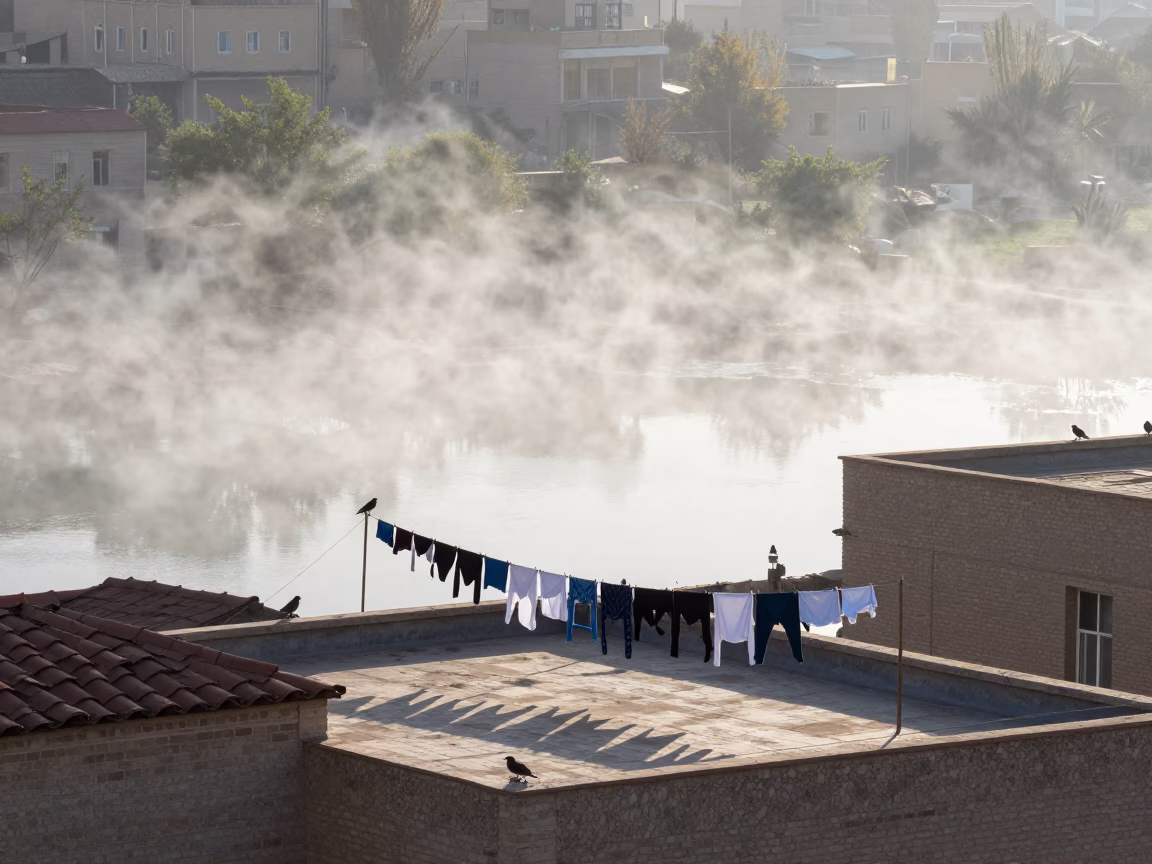 Rooftop Line Over Tehran Valley With Fog in across a wide valley floor near Tehran