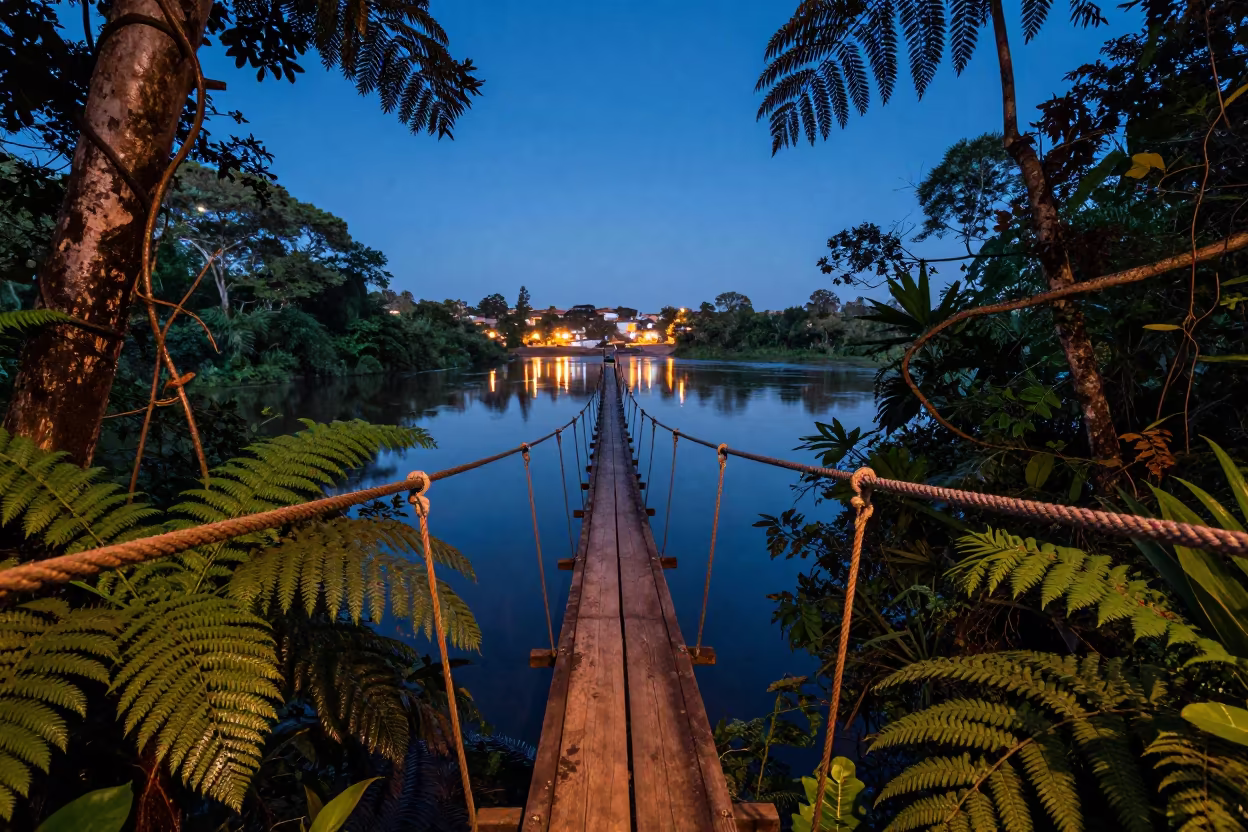 Rope Bridge Swings Over Jungle Gorge at Indigo Twilight in in Madagascar
