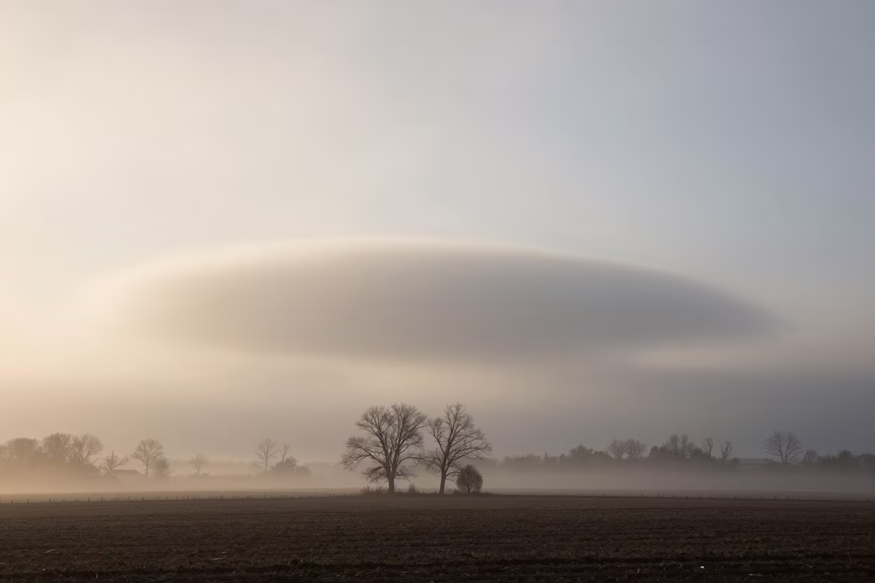 Rotating Wall Cloud Above Dawn Cropland in beneath fast-moving cloud bands near Providence