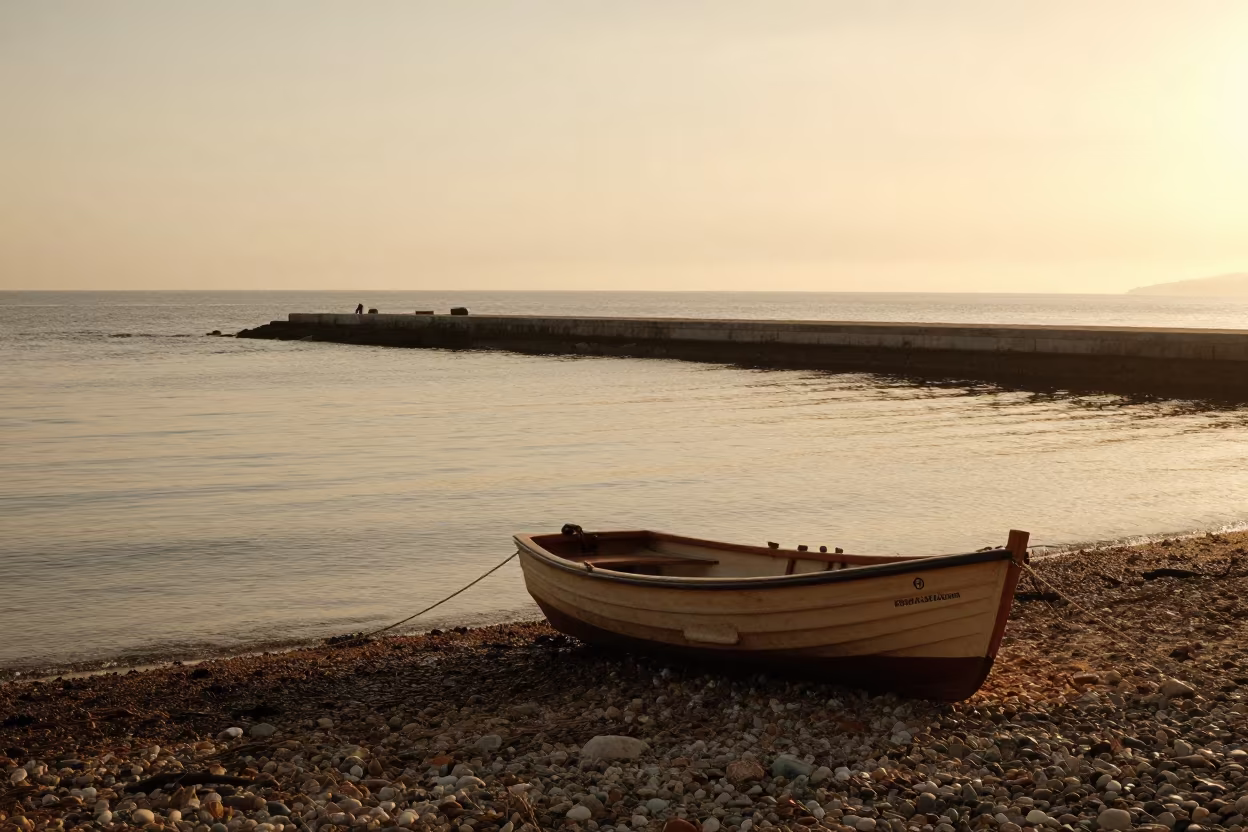 Rowboat on Pebble Beach Lisbon Evening in on a wind-open causeway near Lisbon