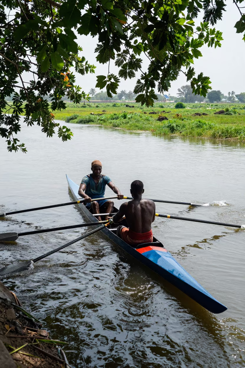 Rower Pulling Oars in Dappled Monsoon Light in near open fields near Kano