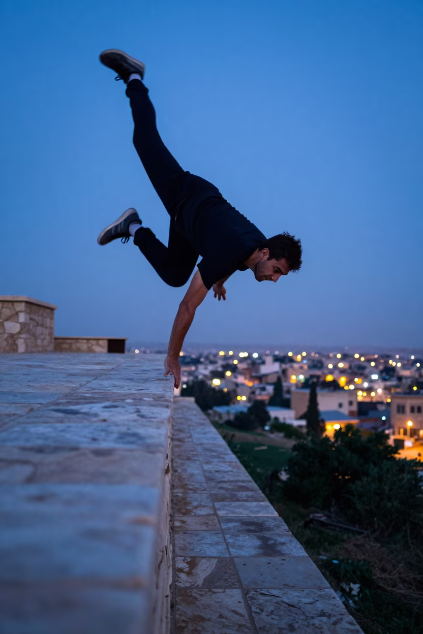 Runner Balancing on Ramadi Parapet in Blue Hour in on a mountain path near Ramadi