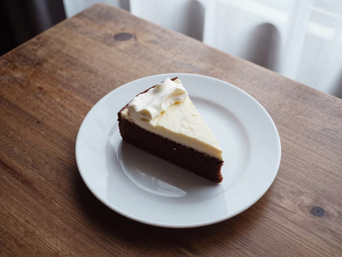Sachertorte with Cream on Tokyo Table in on a rustic wooden table in Tsukiji, Tokyo