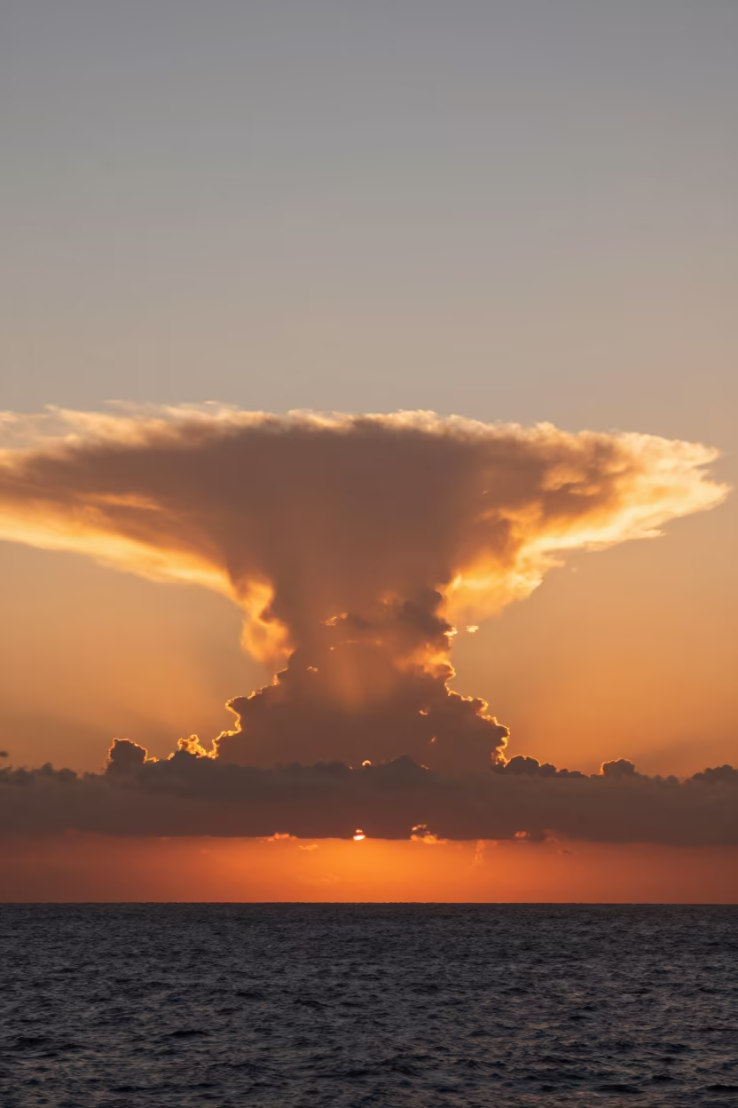 Saharan Dust Sunset Over Atlantic Thunderheads in over a horizon of stacked thunderheads in the Loire Valley