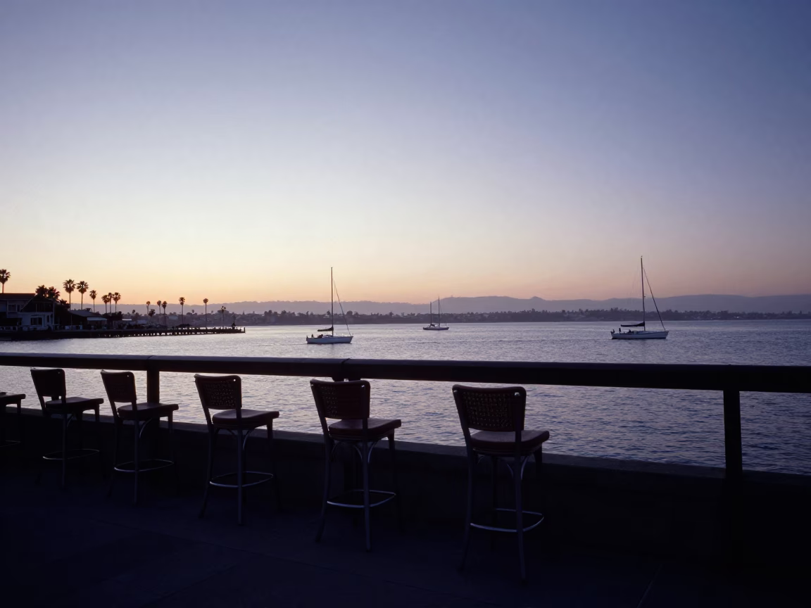 San Diego Coastal Dawn with Bar Stools and Sailboats Before Sunrise in in San Diego, California, United States