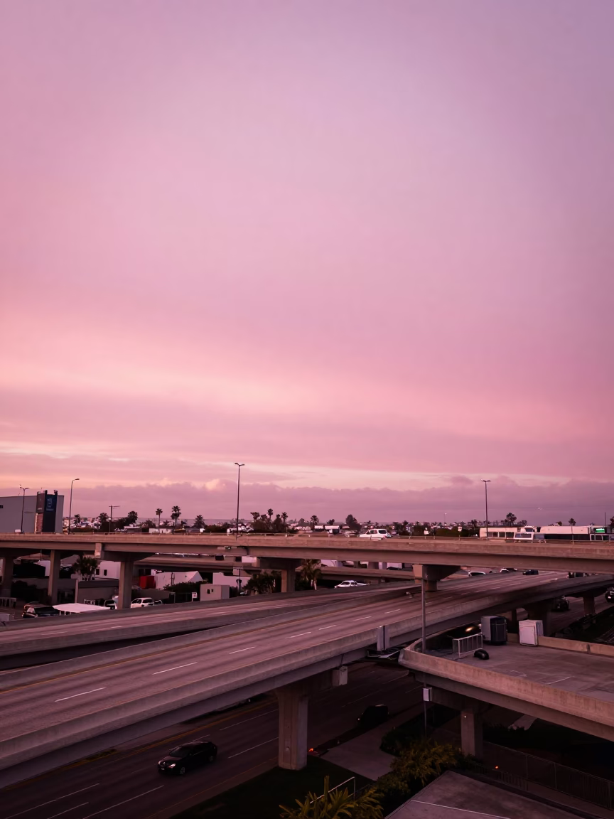San Diego Highway Flyover Stack Cutting Across Pink Evening Sky in California in in San Diego, California, United States