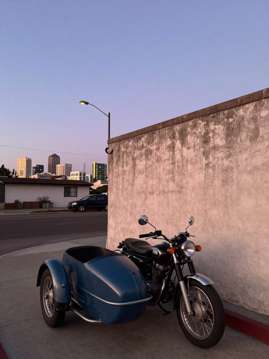 San Diego street scene at dusk with vintage motorcycle and succulents in in San Diego, California, United States