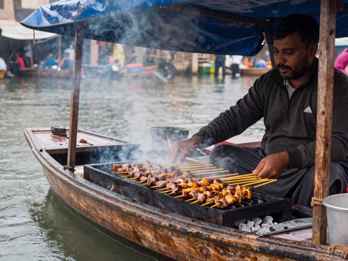 Satay Vendor Grilling on Sana'a Market Boat in under a market canopy in Sana'a