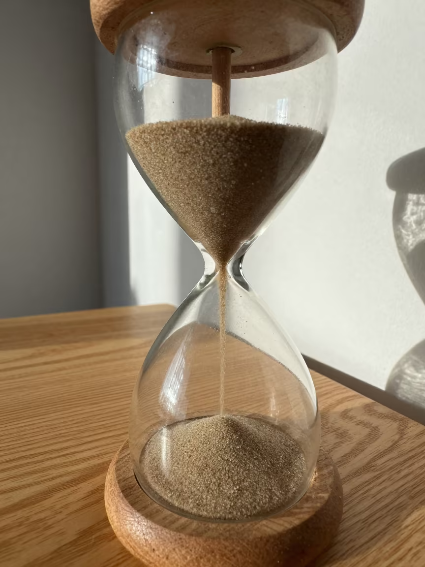 Sand Flowing in Hourglass on Rothenburg Table in on a bedside table near Rothenburg