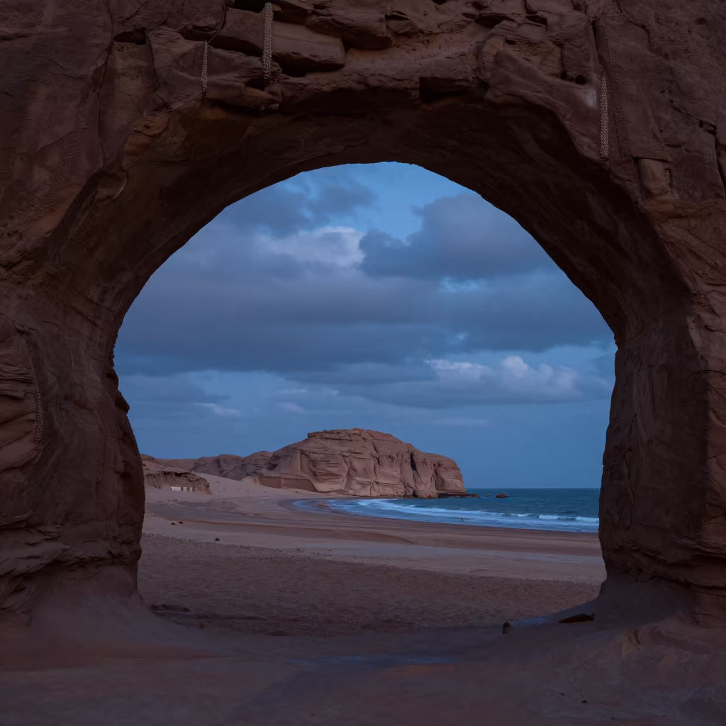 Sandstone Arch Framing Distant Desert Mesa in along a wave-cut shoreline near Marrakech