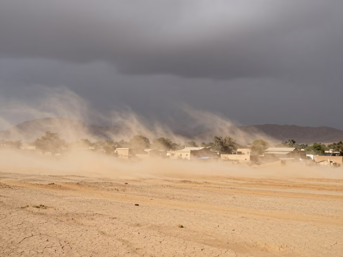 Sandstorm Approaching Rajasthan Village Horizon in over a horizon of stacked thunderheads in Rajasthan