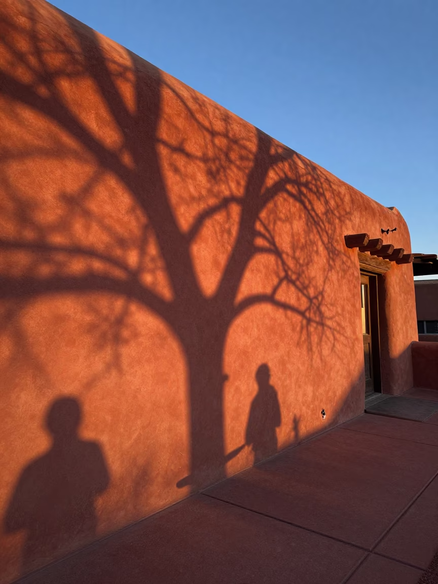 Santa Fe Adobe Courtyard at Dawn with Wicker Shadows and Clay Pots in in Santa Fe, New Mexico, United States