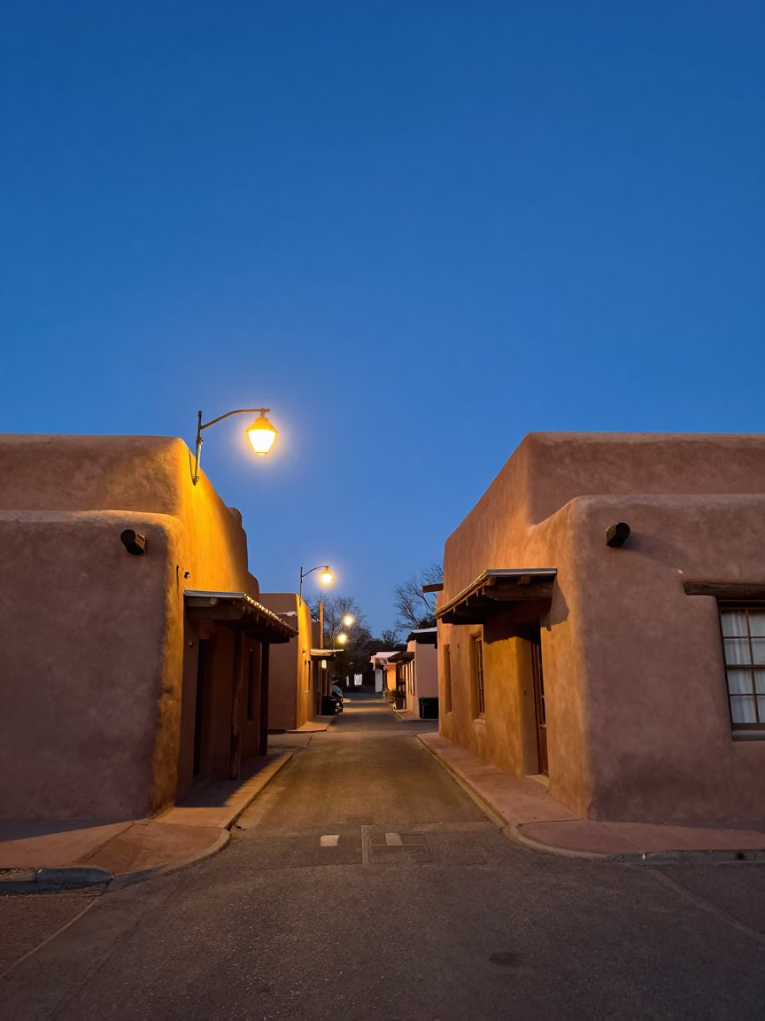 Santa Fe New Mexico adobe architecture and street lamps at blue hour in in Santa Fe, New Mexico, United States