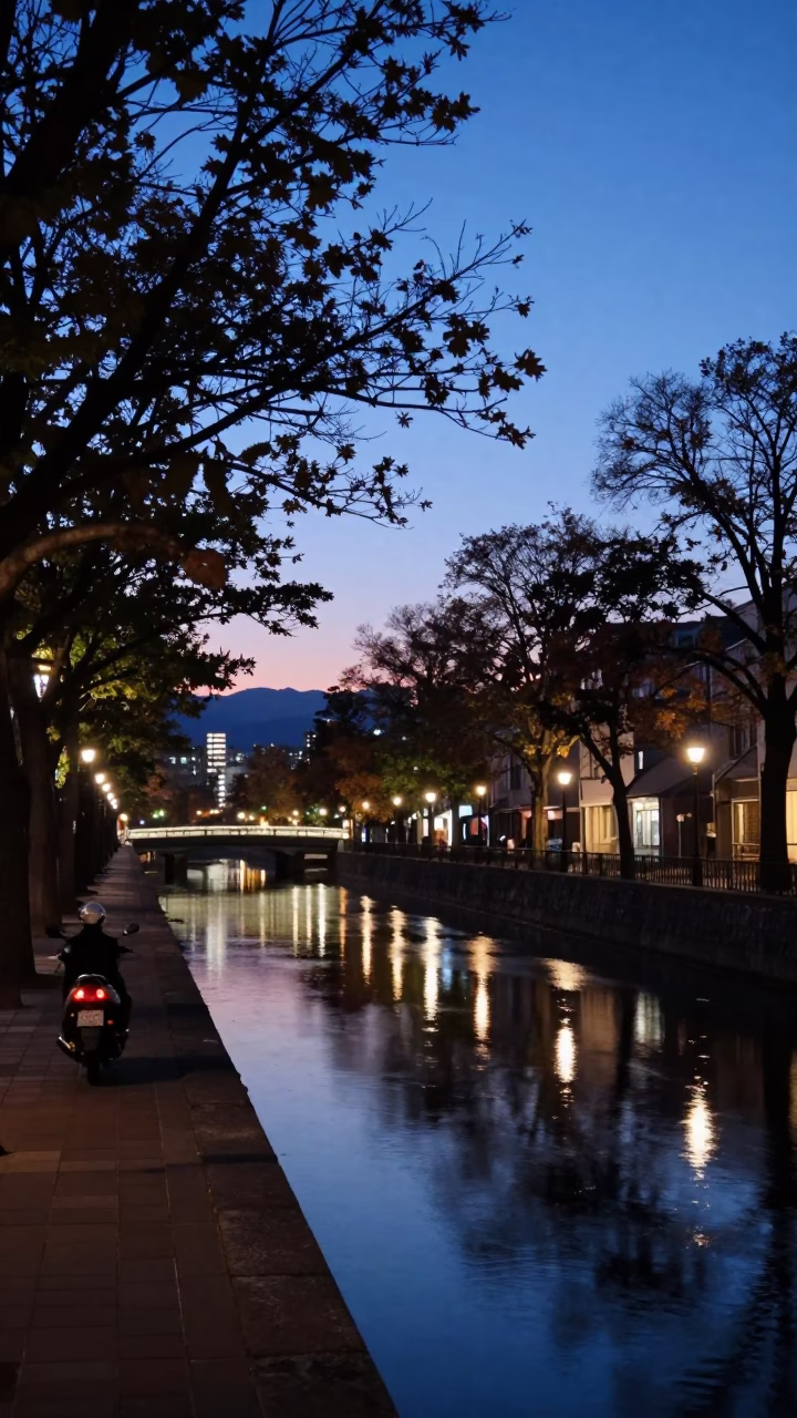 Sapporo Japan Blue Hour Street Scene with Motorcycle and Canal Reflections in in Sapporo, Japan