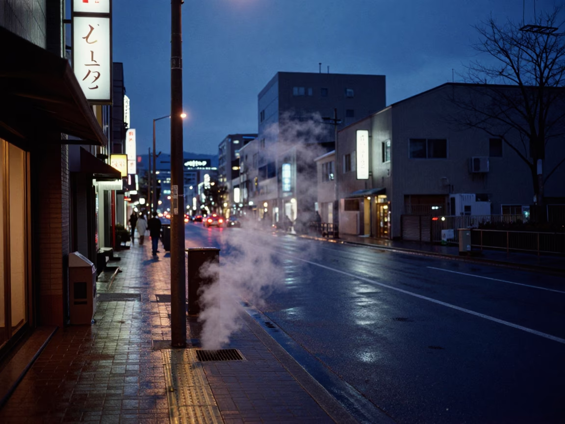 Sapporo Japan predawn street scene with neon lights and wet pavement reflections in in Sapporo, Japan