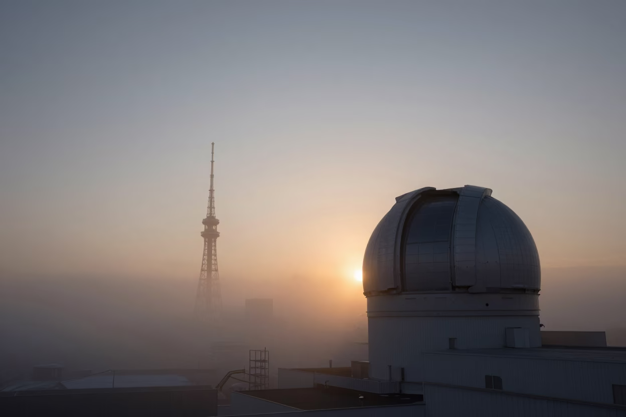 Sapporo Japan Sunset Observatory Dome Silhouette Above Drifting Ground Fog in in Sapporo, Japan