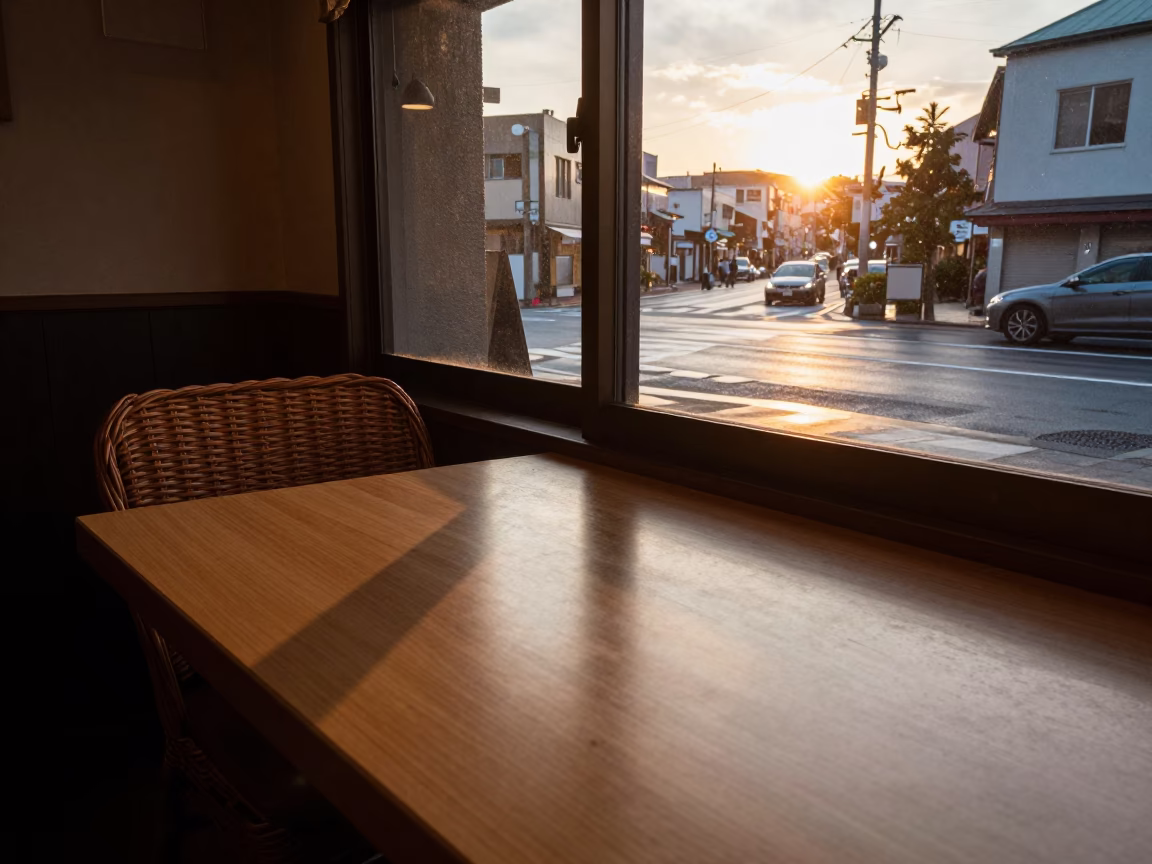 Sapporo Japan Sunset Street Scene with Wicker Chair Shadow on Cafe Countertop in in Sapporo, Japan