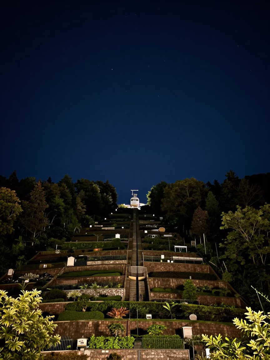 Sapporo Night Sky Horizon with Funicular Rising Through Terraced Gardens Under Deep Darkness in in Sapporo, Japan