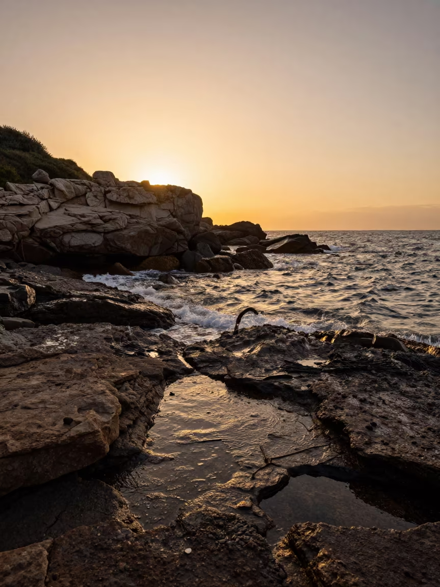 Sardinian Shoreline Silhouette at Golden Hour Drizzle in along a wave-cut shoreline in Sardinia