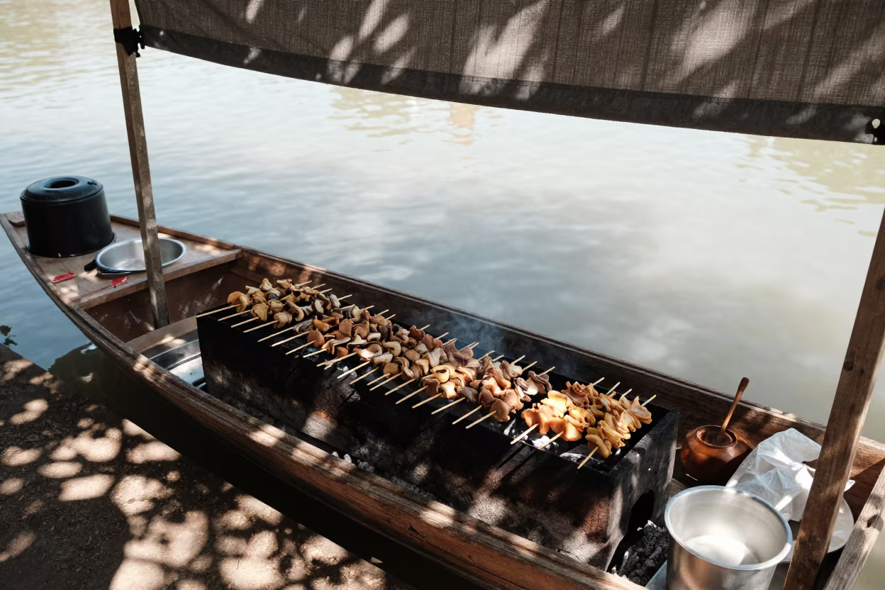Satay Vendor Grilling on Boat Under Canopy in under a market canopy in San Antonio