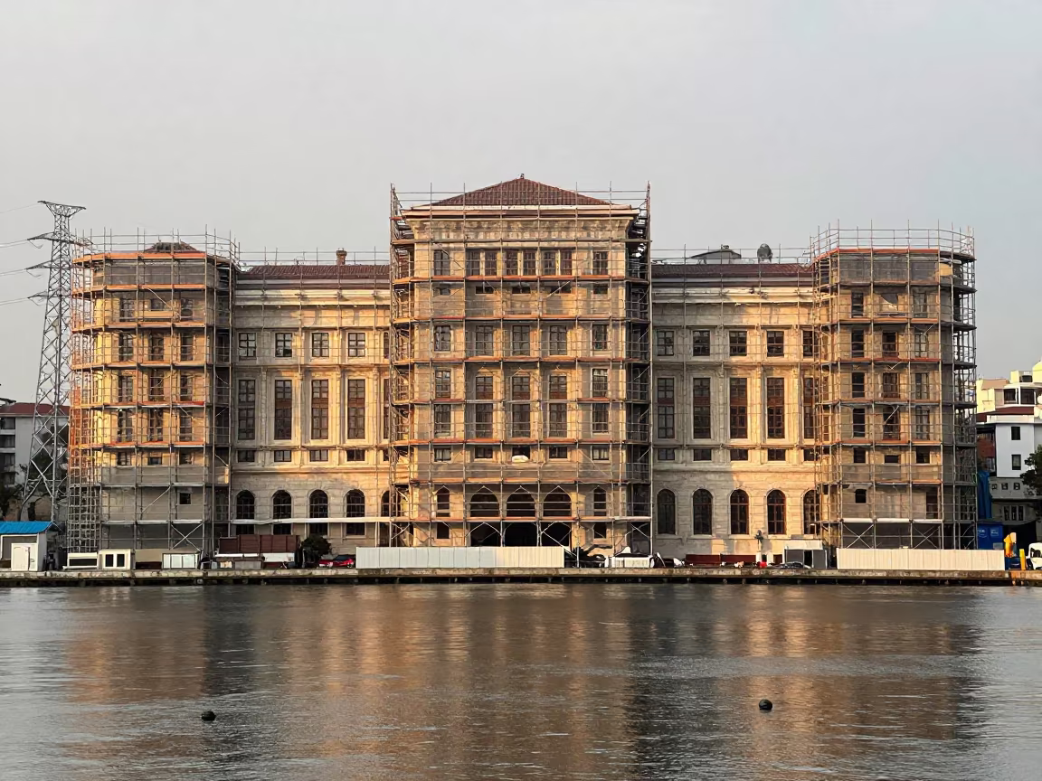 Scaffolding Wraps Historic Building Near Izmir in under gantries and utility towers near Izmir