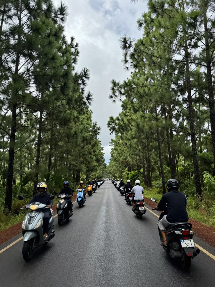 Scooter convoy crossing Kenyan causeway in on a wind-open causeway in Kenya