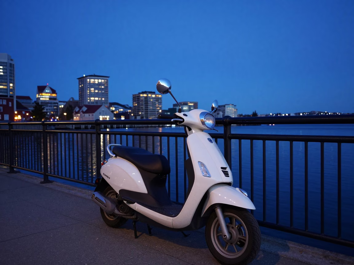 Scooter Parked on Halifax Harbor Promenade at Blue Hour with City Lights Reflecting in in Halifax, Nova Scotia, Canada