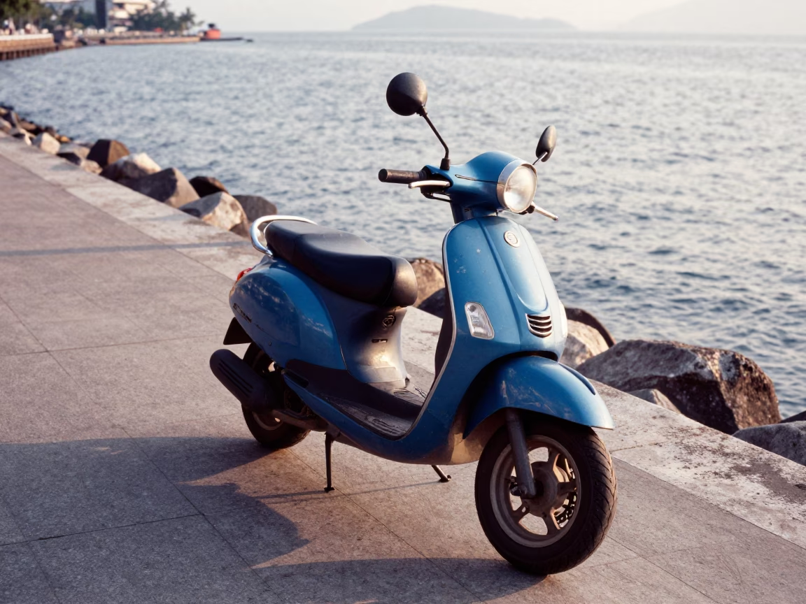 Scooter Parked on Phuket Harbor Promenade Late Afternoon with Tropical Greenery in in Phuket, Thailand