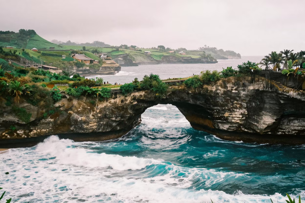 Sea Arch Over Foothills Before Sunrise in from a ridge above layered foothills in Indonesia