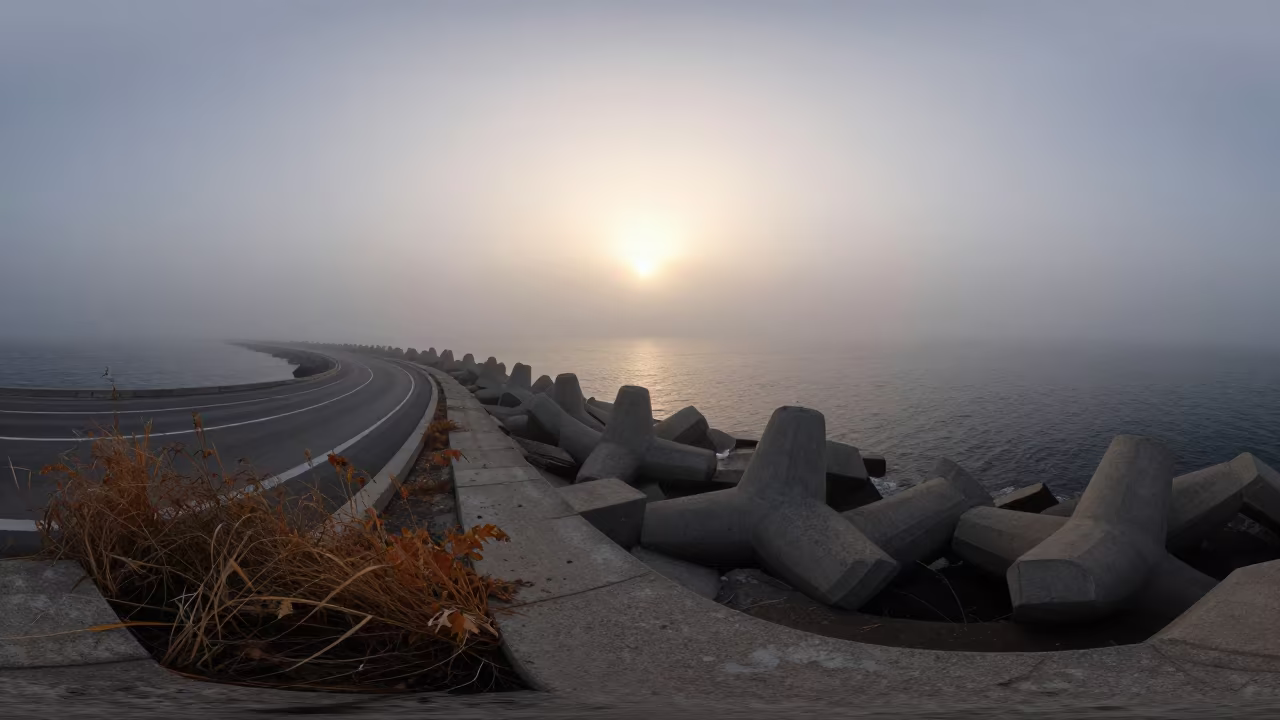Sea Fog Crawls Greek Breakwater Dawn Light in across a windy overpass interchange in Greece