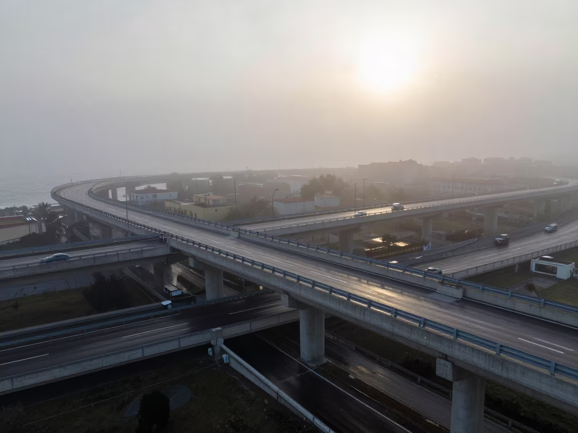 Sea Fog Crawling Over Naples Breakwater Dawn in across a windy overpass interchange near Spaccanapoli, Naples