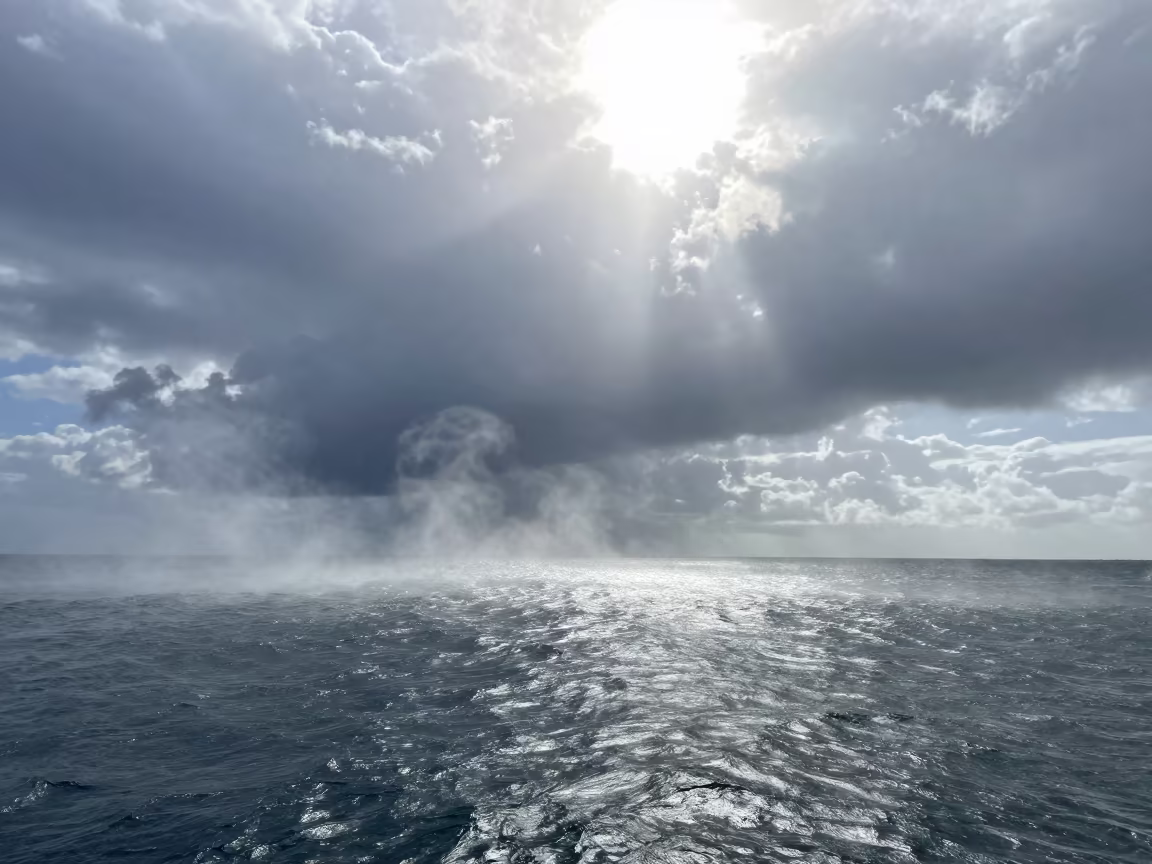 Sea Smoke Over Salvador Thunderheads at Noon in over a horizon of stacked thunderheads near Salvador
