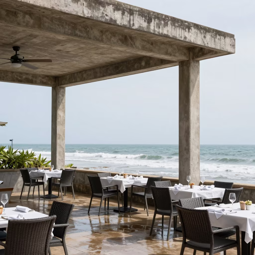 Sea Wind Lifts White Napkins at Maputo Resort Terrace in beneath a porte cochere at arrival in Maputo