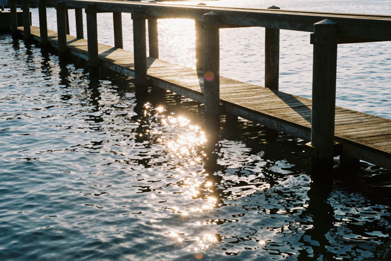 Seattle Waterfront Noon Sunlight Reflections on Dock Pilings and Water in in Seattle, Washington, United States