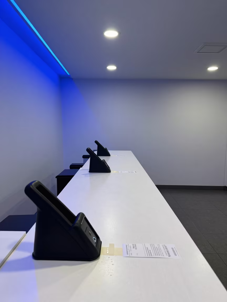 Security Tag Detacher in Al-Fashir Store in at a checkout lane under flat store light in Al-Fashir