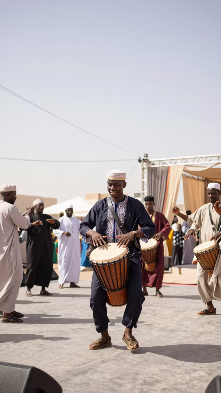 Senegalese Drummer Leading Dance Circle Ajman Festival in on a festival main stage in Ajman