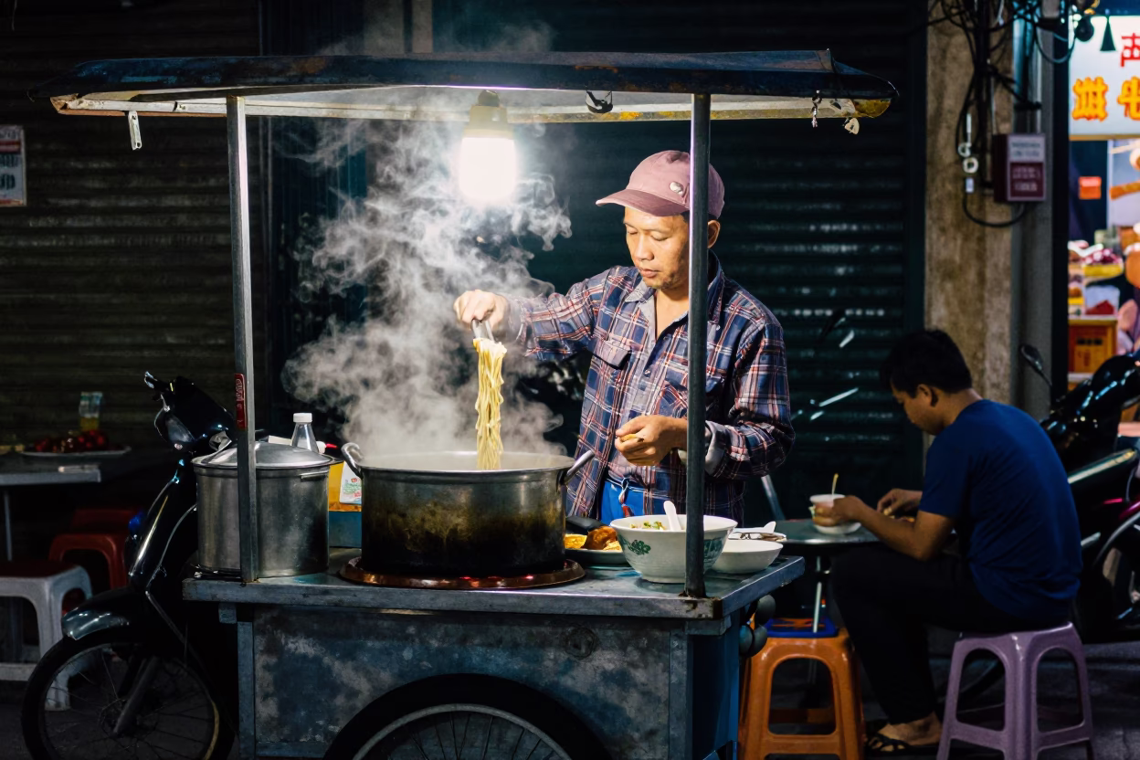 Serving Noodles in Hanoi at Late At Night Light in in Hanoi, Vietnam