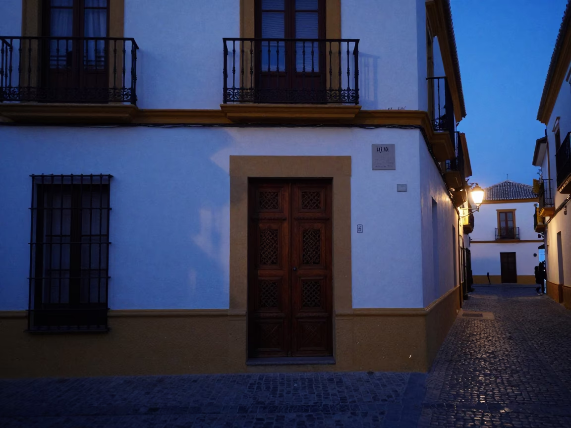 Seville Andalusian Street Scene at Indigo Twilight with Traditional Door Wreaths in in Seville, Spain