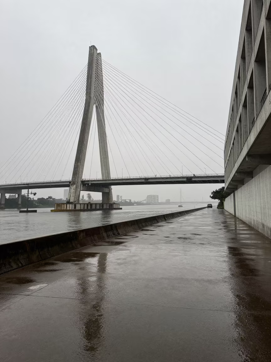 Shadow Play on Bridge Deck Near Recife Canal in beside a canal-front facade near Recife