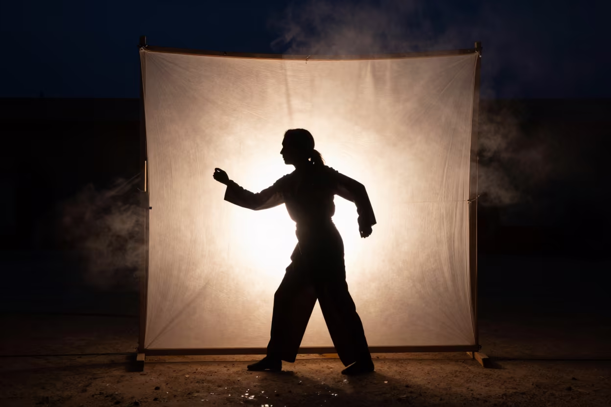 Shadow Puppet Master in Predawn Nabatieh Haze in on a dimly lit stage in Nabatieh